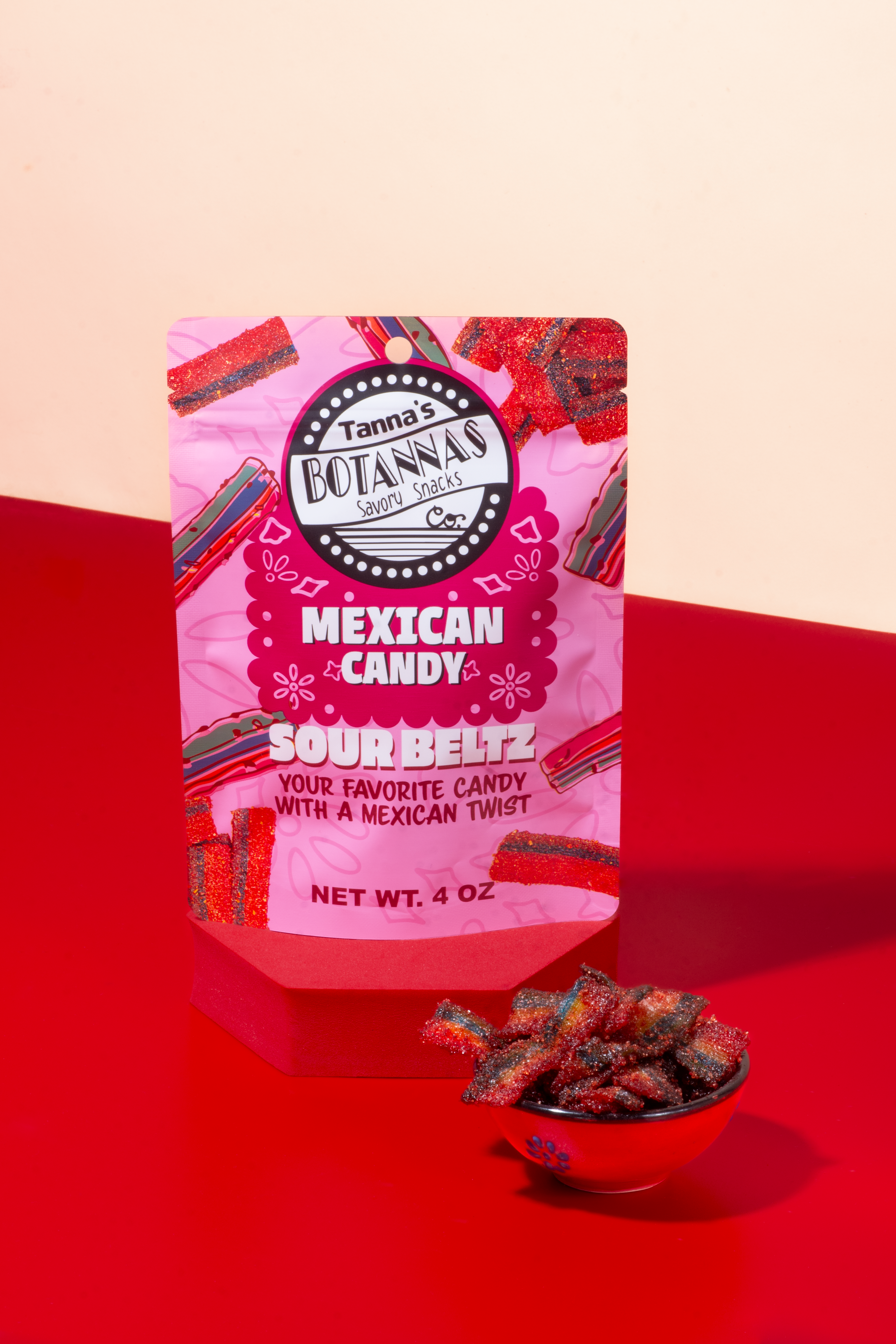 Tamaña's Botaniss Mexican Candy Sour Beltz packaging on a red background